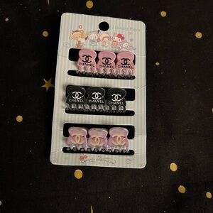 CHANEL Pink, Black, and Lavender Hair Clip Set